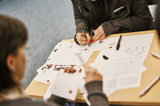 Practising Korean writing at a calligraphy workshop