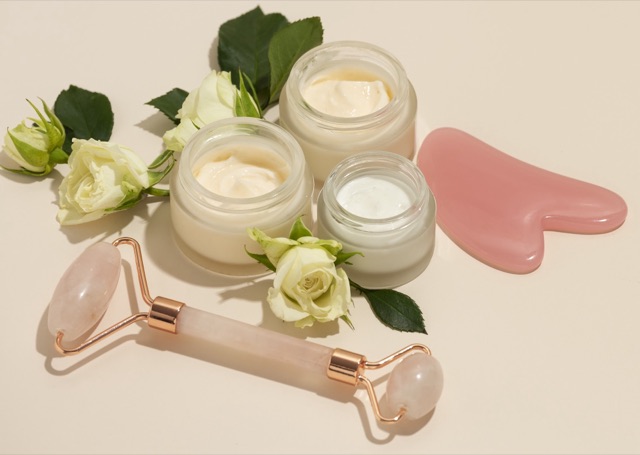 Beauty products, a facial roller and a gua sha tool